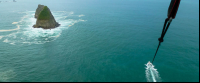 parasailing in the air 
 - Costa Rica