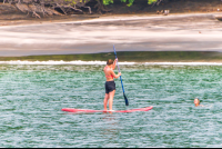 Lady Doing Stand Up Paddle In Playa Huevos Marlin Del Ray Catamaran
 - Costa Rica