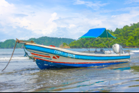 Small Boat Anchored In Playa Curu Curu Wildlife Refuge
 - Costa Rica