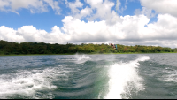 a make jumping above lake arenal as he wakeboards
 - Costa Rica