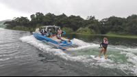 wakeboarding lesson on lake arenal an instructor tells a guest how to do it
 - Costa Rica