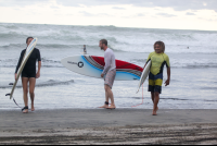 Three Surfers In Guiones Beach
 - Costa Rica