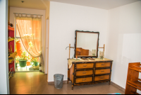 View of the dresser and a patio window from the bed - Costa Rica