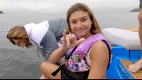 lady smiles to the camera as she prepares for jumping in the lake
 - Costa Rica