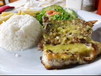 Grilled Fish Over Garlic Sauce At Perla Del Sur Restaurant
 - Costa Rica