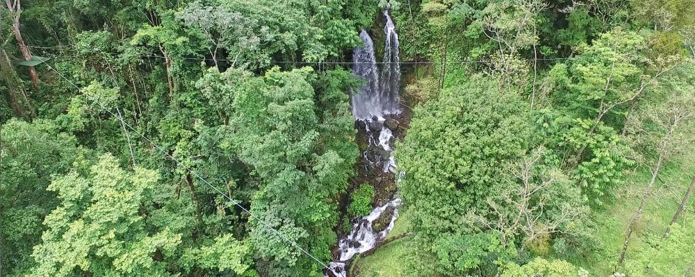 las gemelas double cascade waterfall view from zipline cable
 - Costa Rica