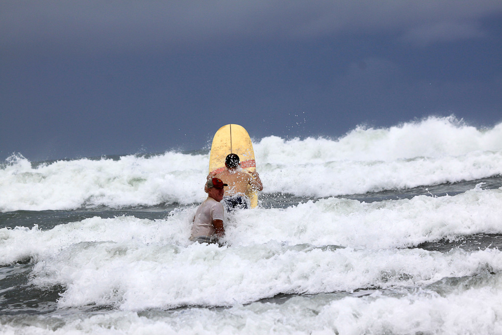 lagarto surf company in the waves 
 - Costa Rica