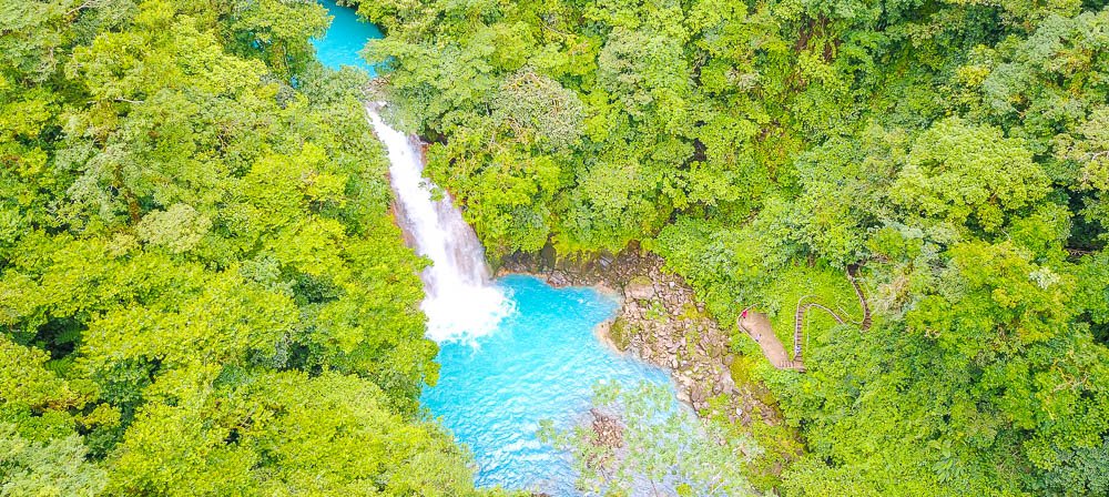 celeste river waterfall aerial view with step trail dji
 - Costa Rica