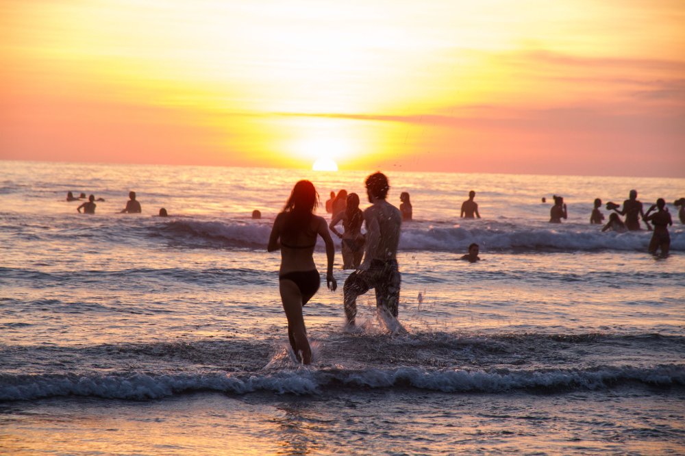 enjoying the waters at sunset envision festival costa rica
 - Costa Rica