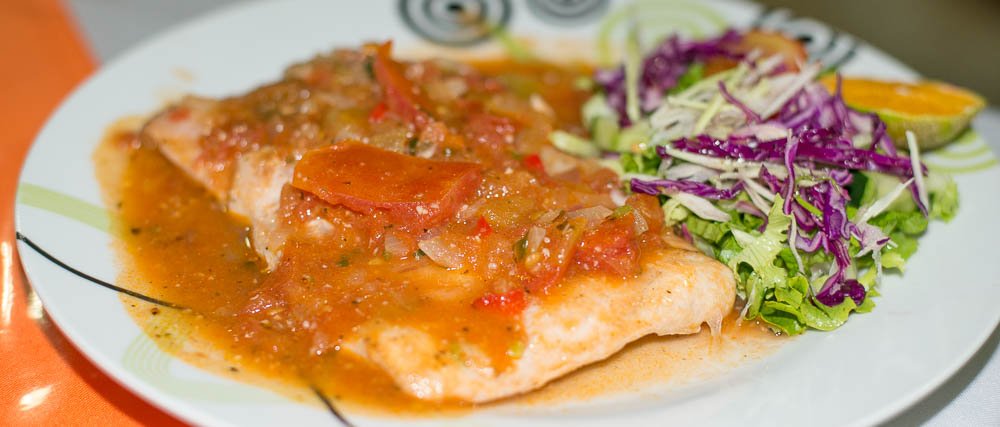 seabass on tomatoe sauce with salad restaurante carolina
 - Costa Rica