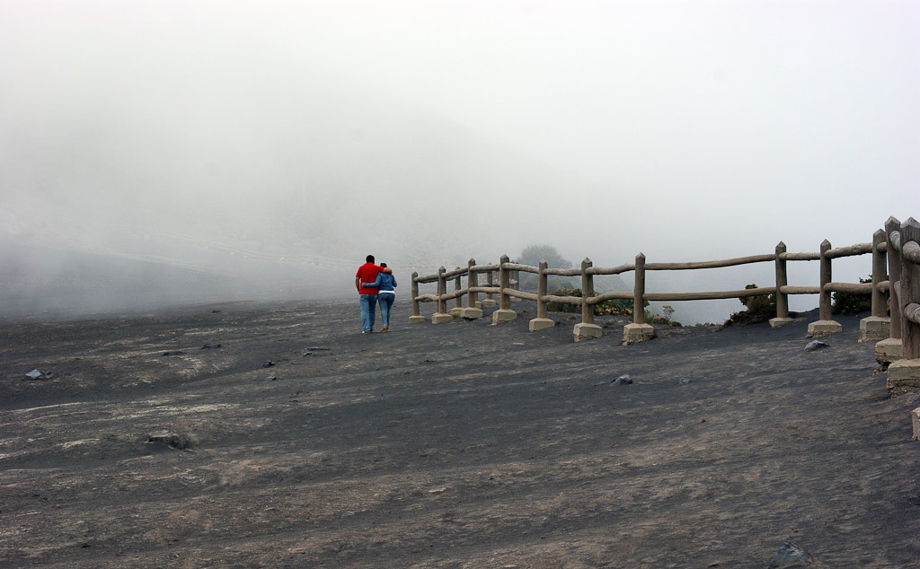 irazu couple walking in fog  
 - Costa Rica