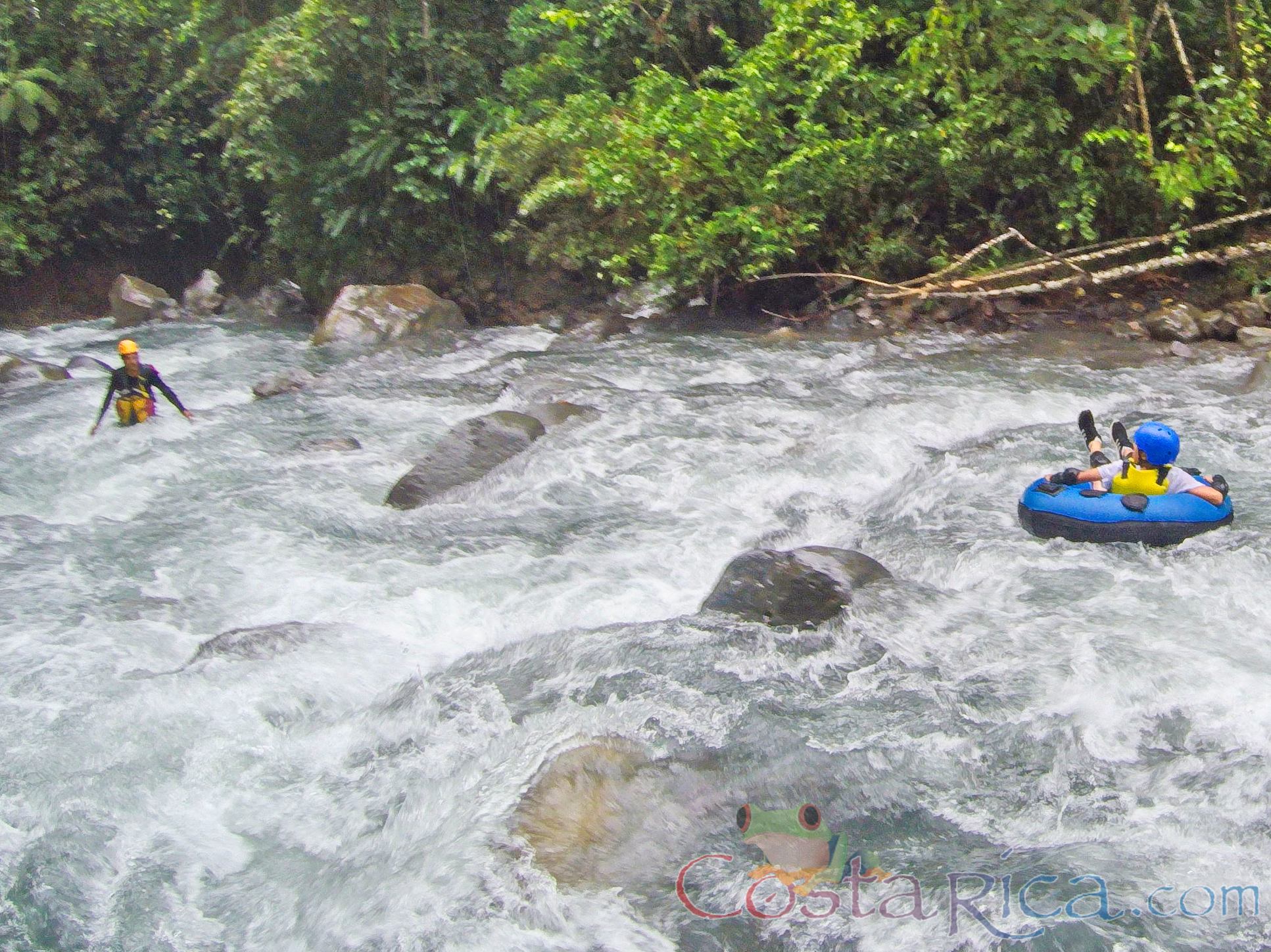 Guide Waiting To Receive A Kid In The Rapids Blue River Tubing Rincon De La Vieja