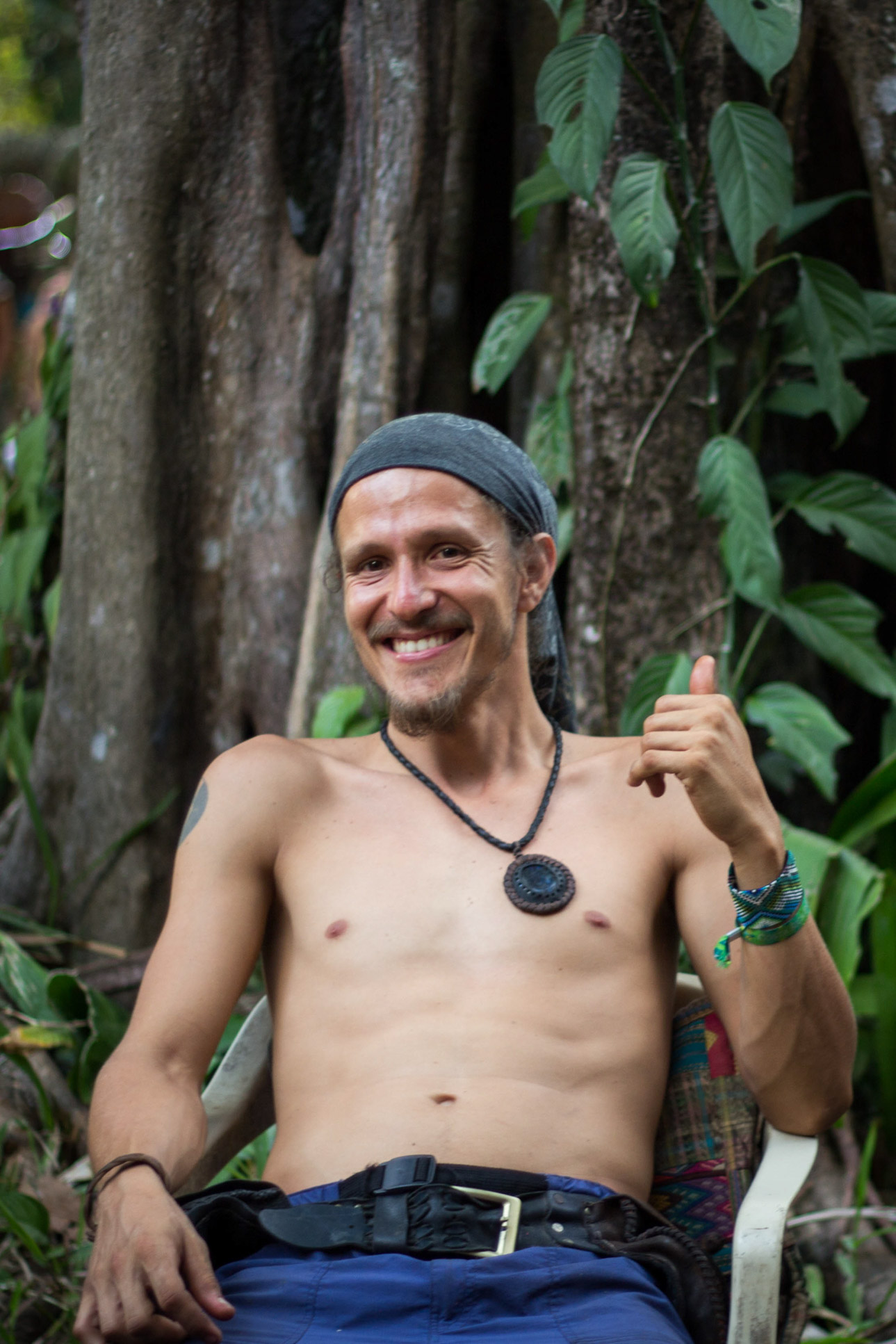Guy Sitting Down Below A Tree Envision Festival Costa Rica