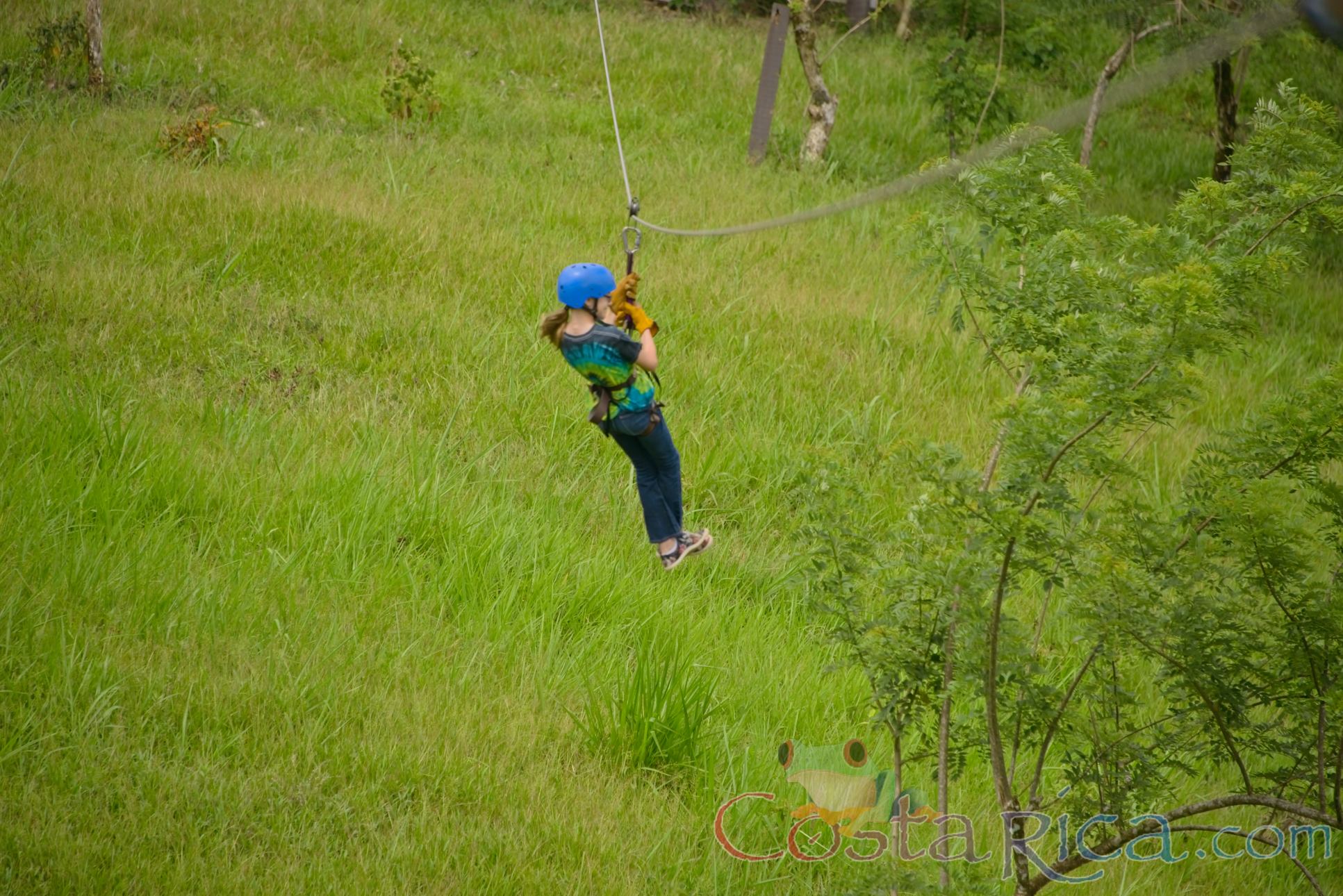 Young Girl Riding A Cable On Blue River Zipline Rincon De La Vieja