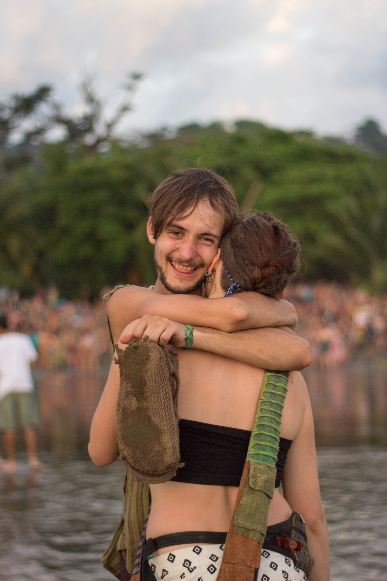 couple hugging on the beach envision festival costa rica 5.jpg