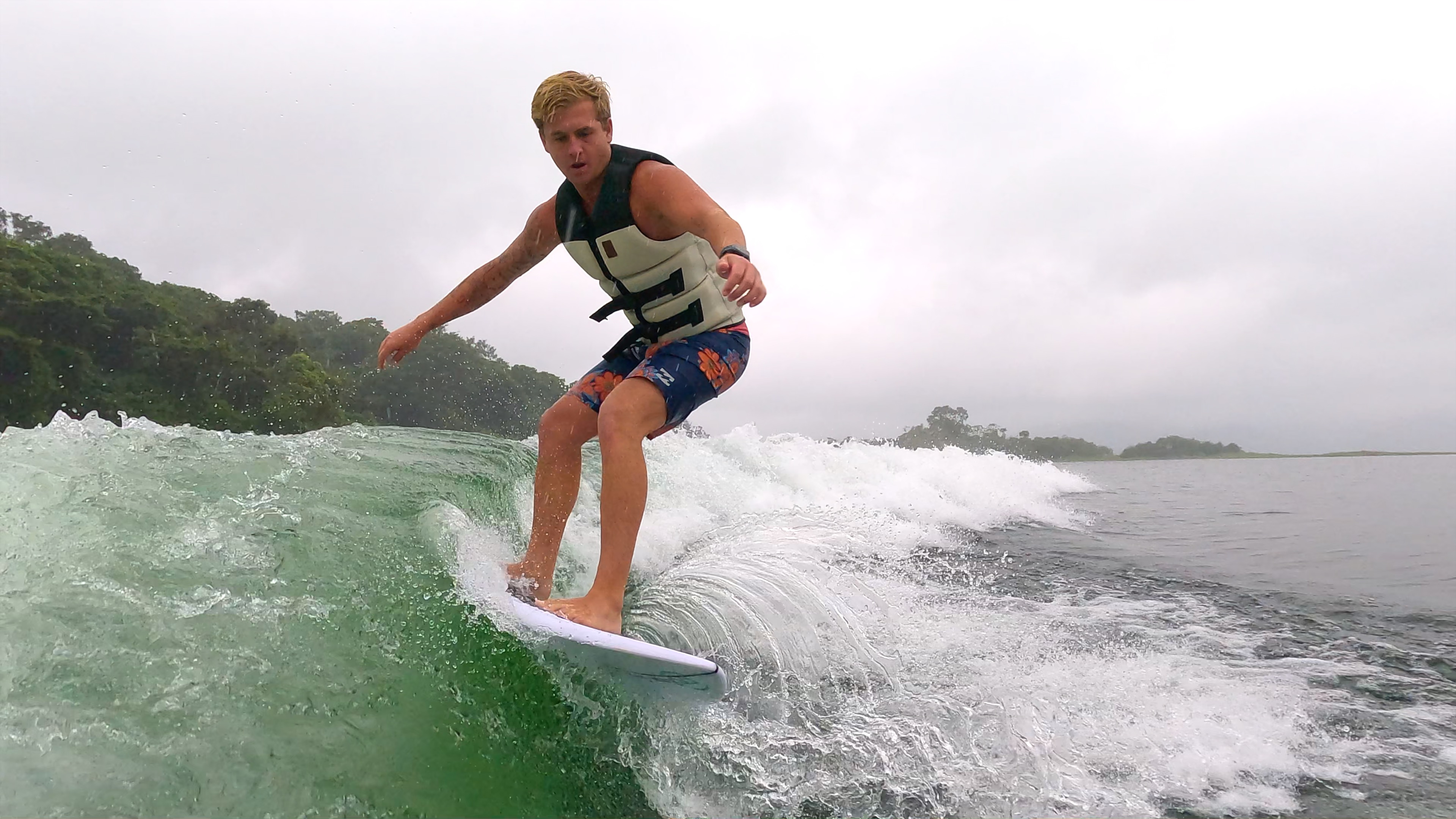 a man wakesurfs on lake arenal in the morning.jpg