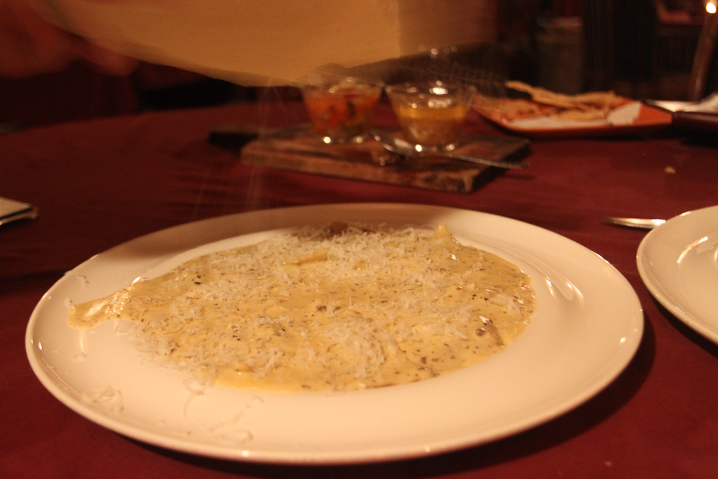grating cheese on black truffle cream ravioli 3.jpg