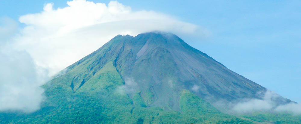 Clouds Hover over Arenal Volcano Verdant Eastern Slope