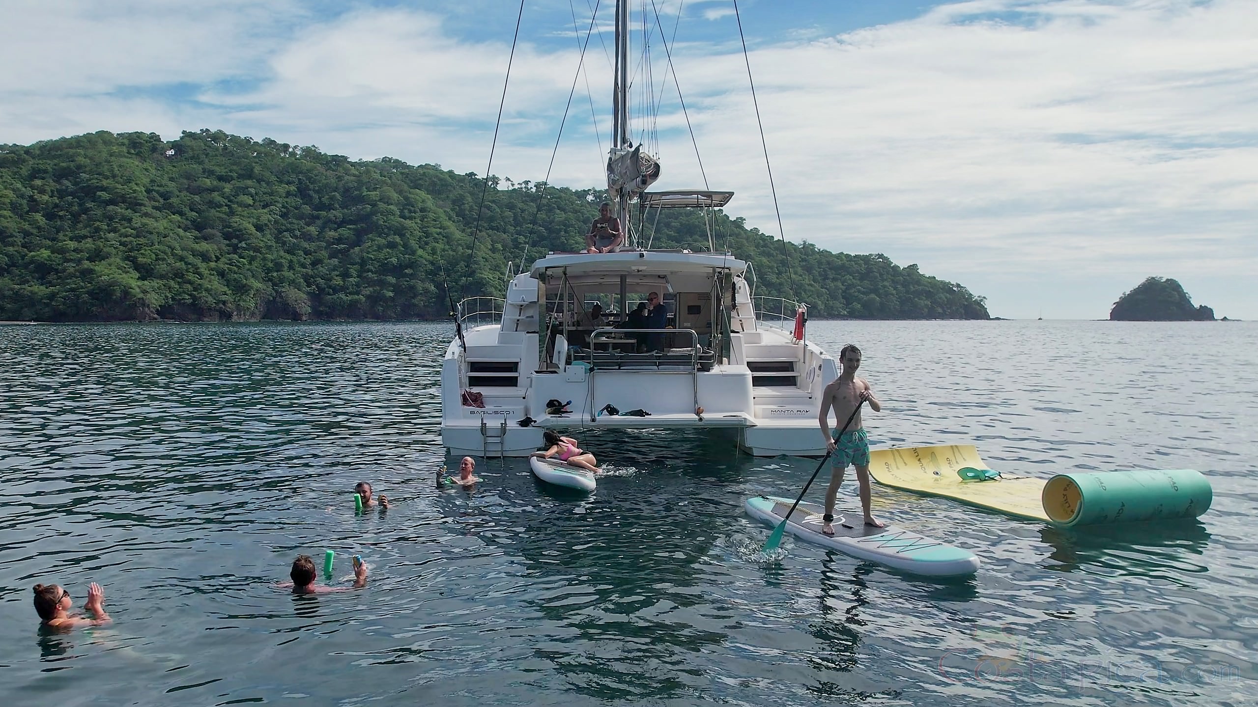rear view with guests doing water activities 41 foot luxury charter catamaran guanacaste.jpg