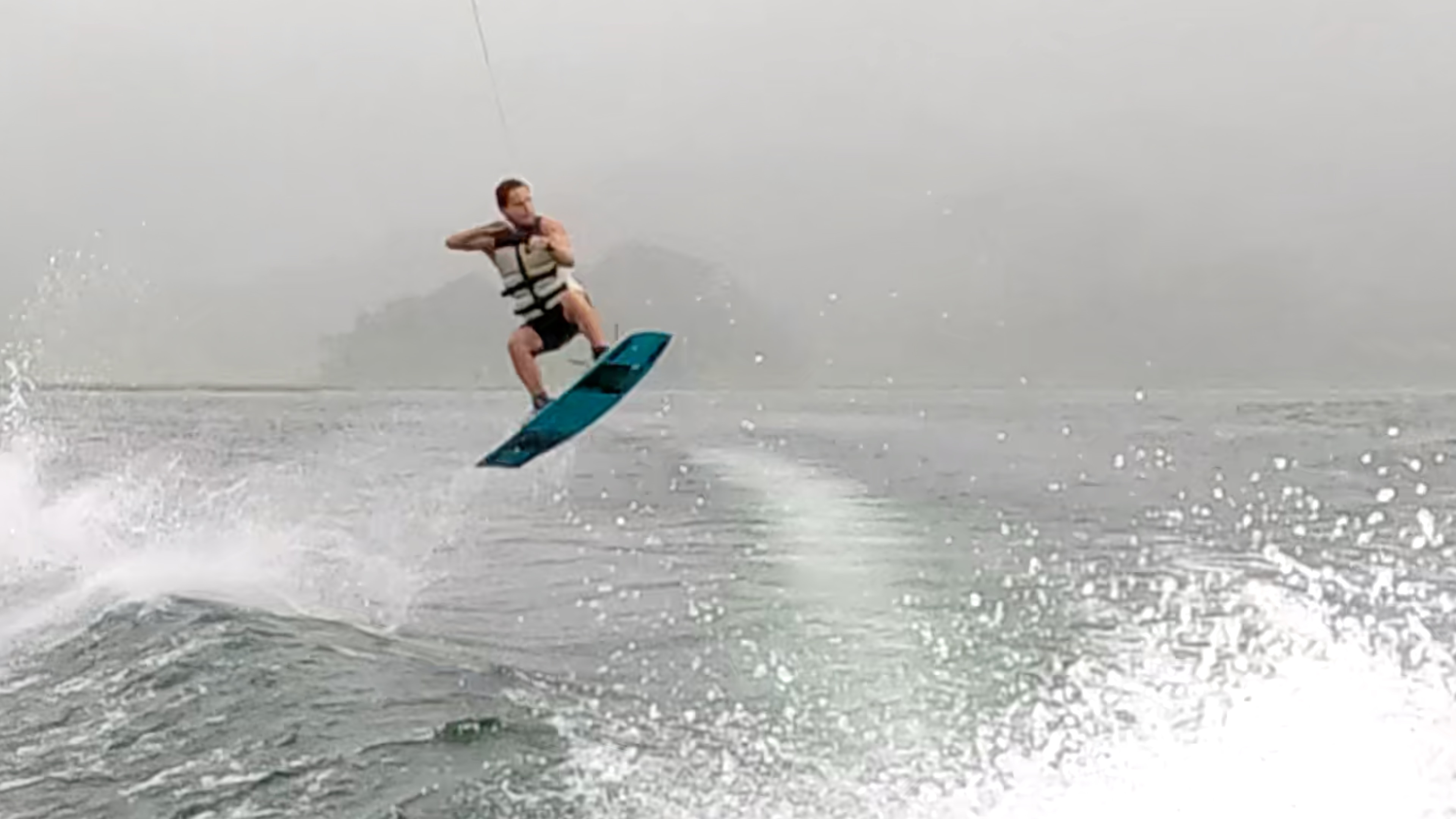 a man up in the air wakeboarding on lake arenal.jpg
