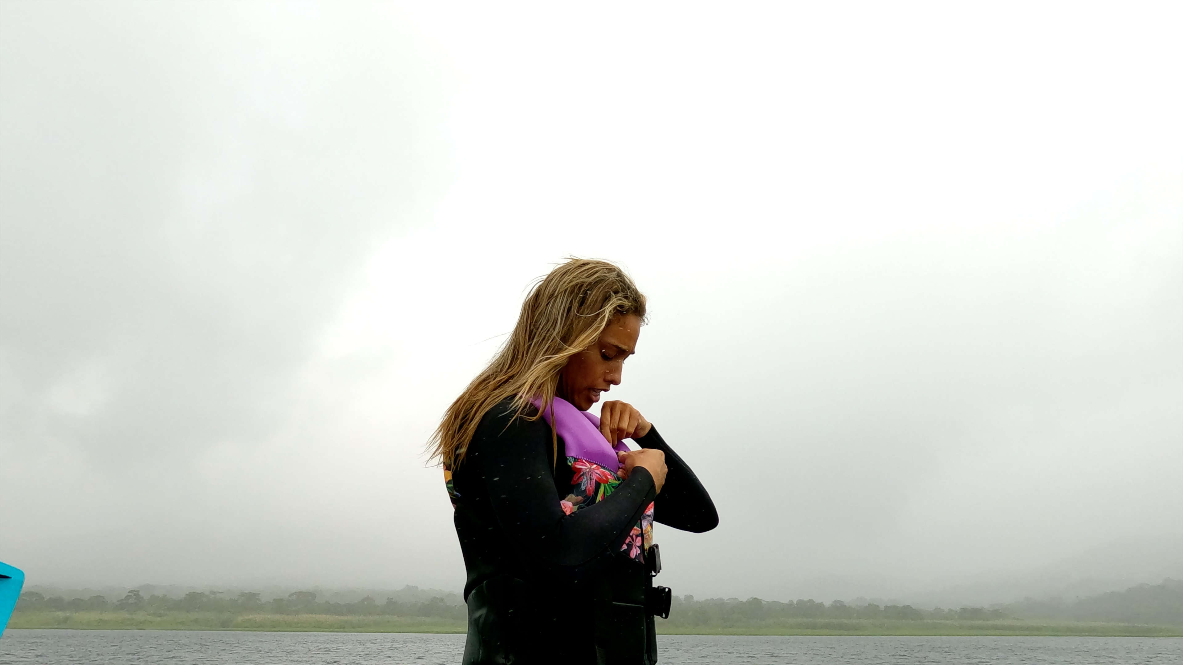 a lady secures her gear to start wakeboarding.jpg
