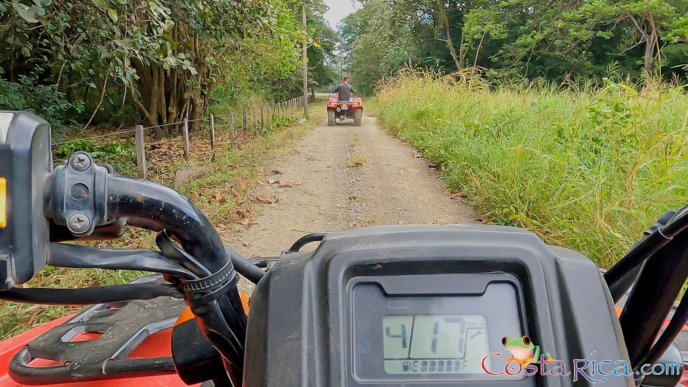 atv nosara tour guide going in front on a dirt trail.jpg