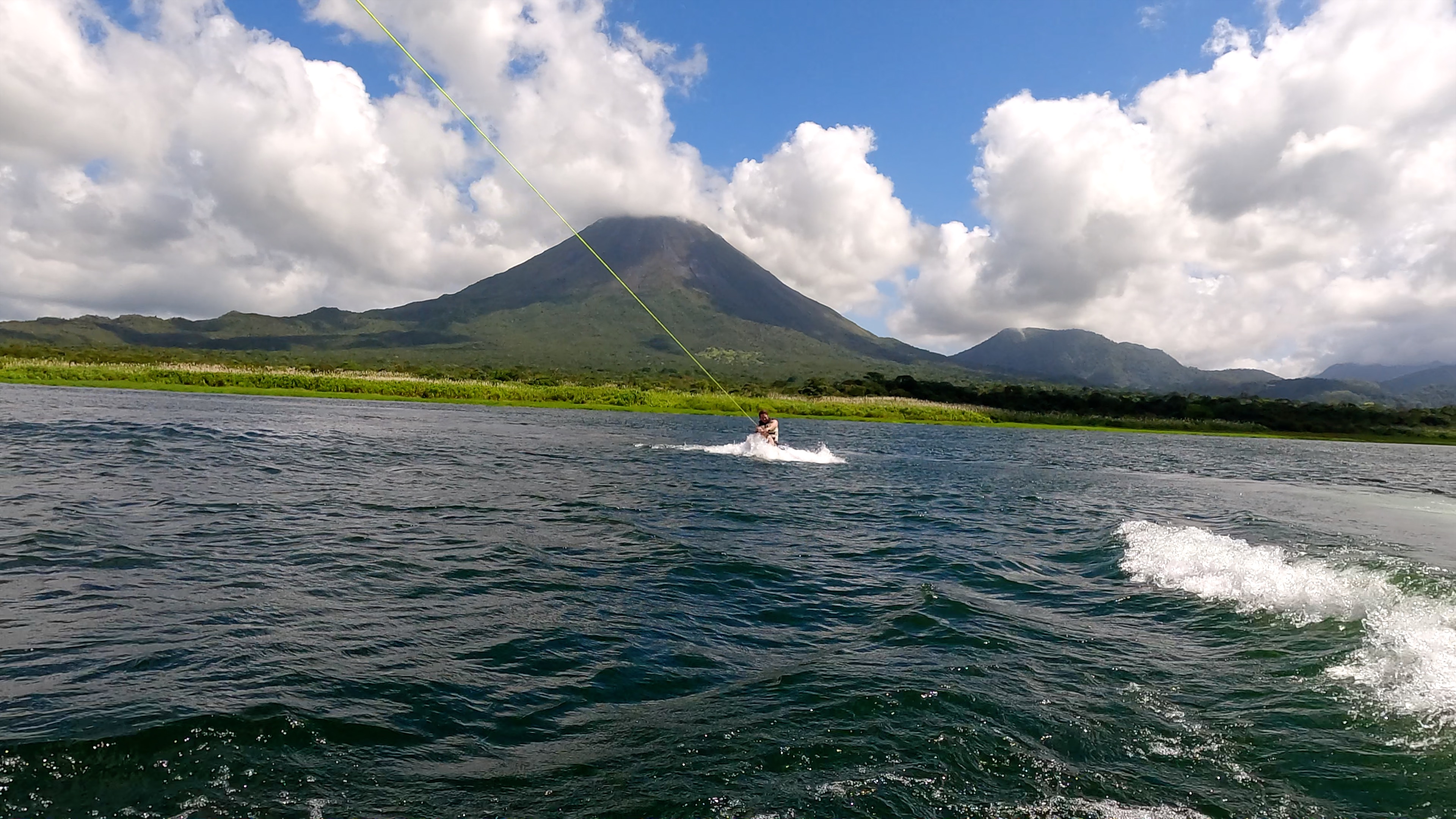 a man starting to wakeboard on lake arenal.jpg