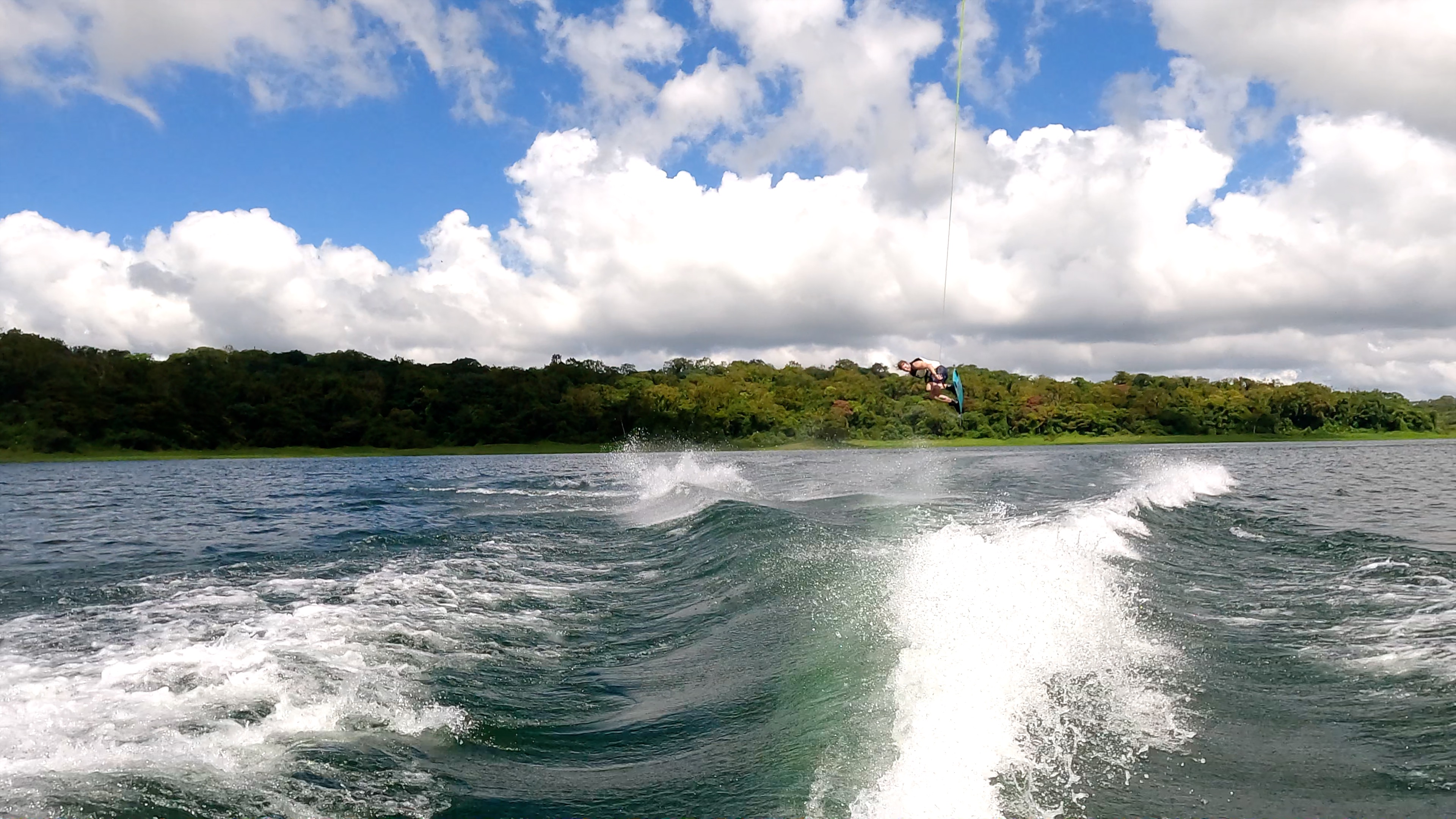 a make jumping above lake arenal as he wakeboards.jpg