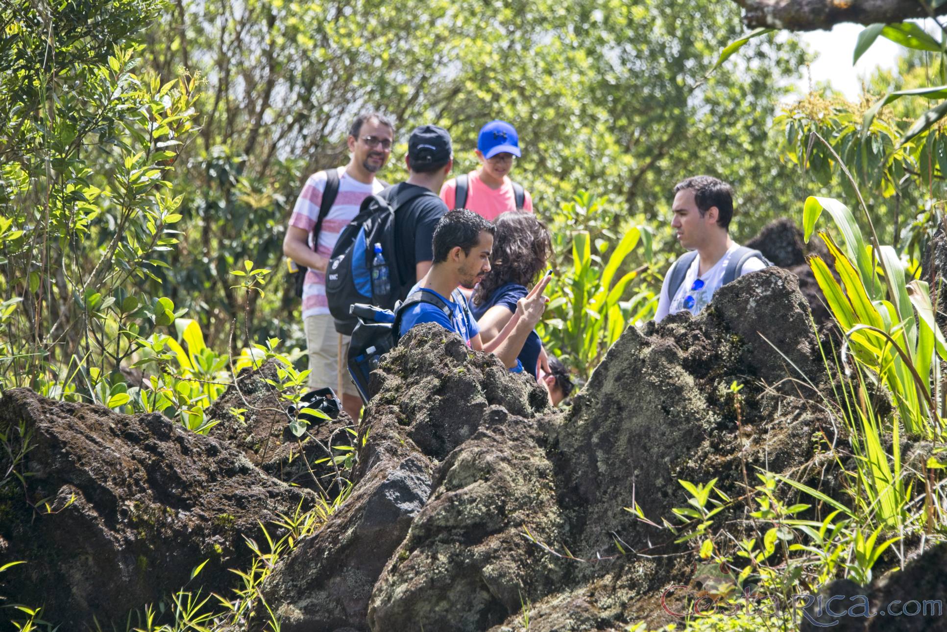 group of tourist taking pictures of the lava molten rocks at 1968 hiking trail.jpg