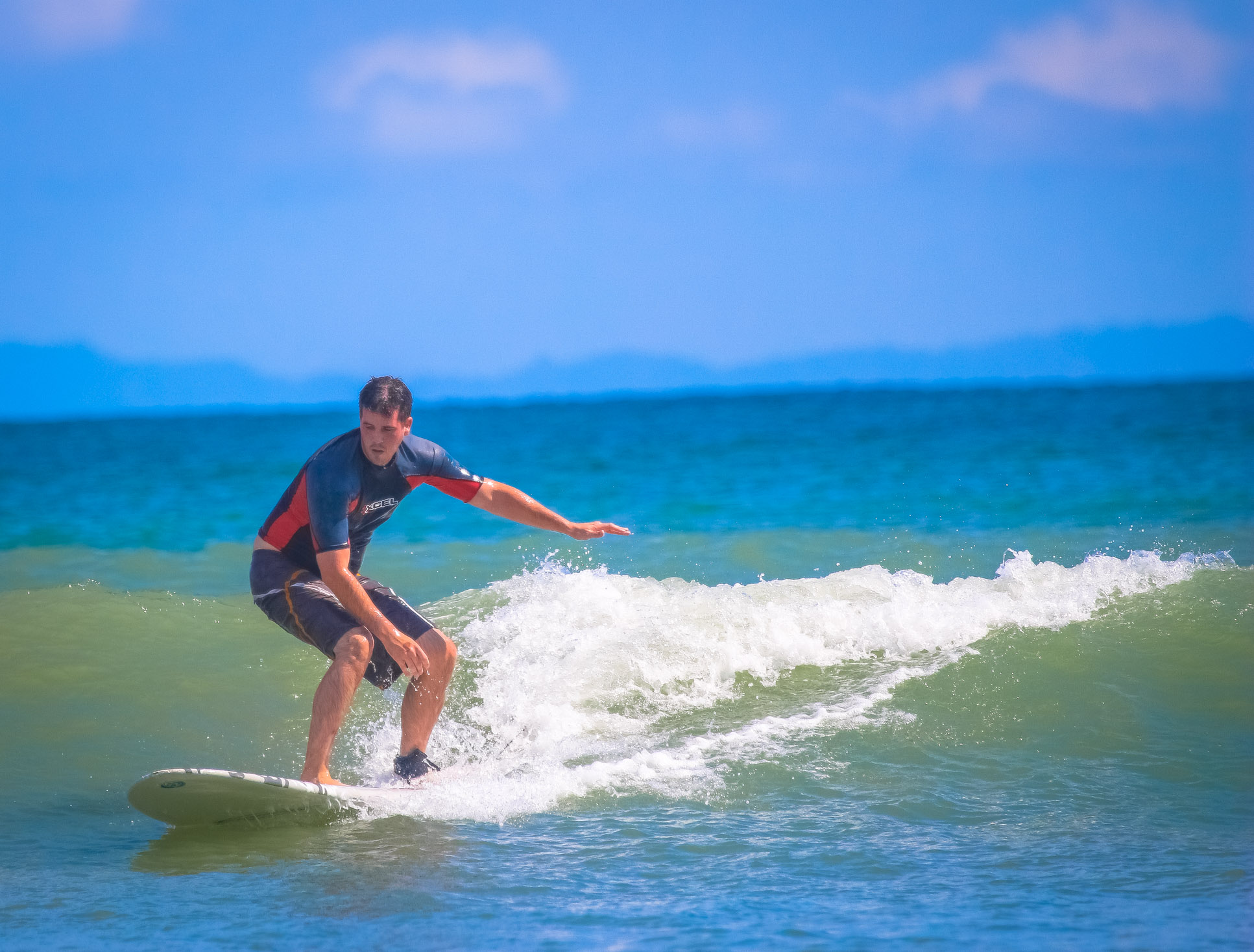 Man Standing On Board Pollo Surf School Matapalo