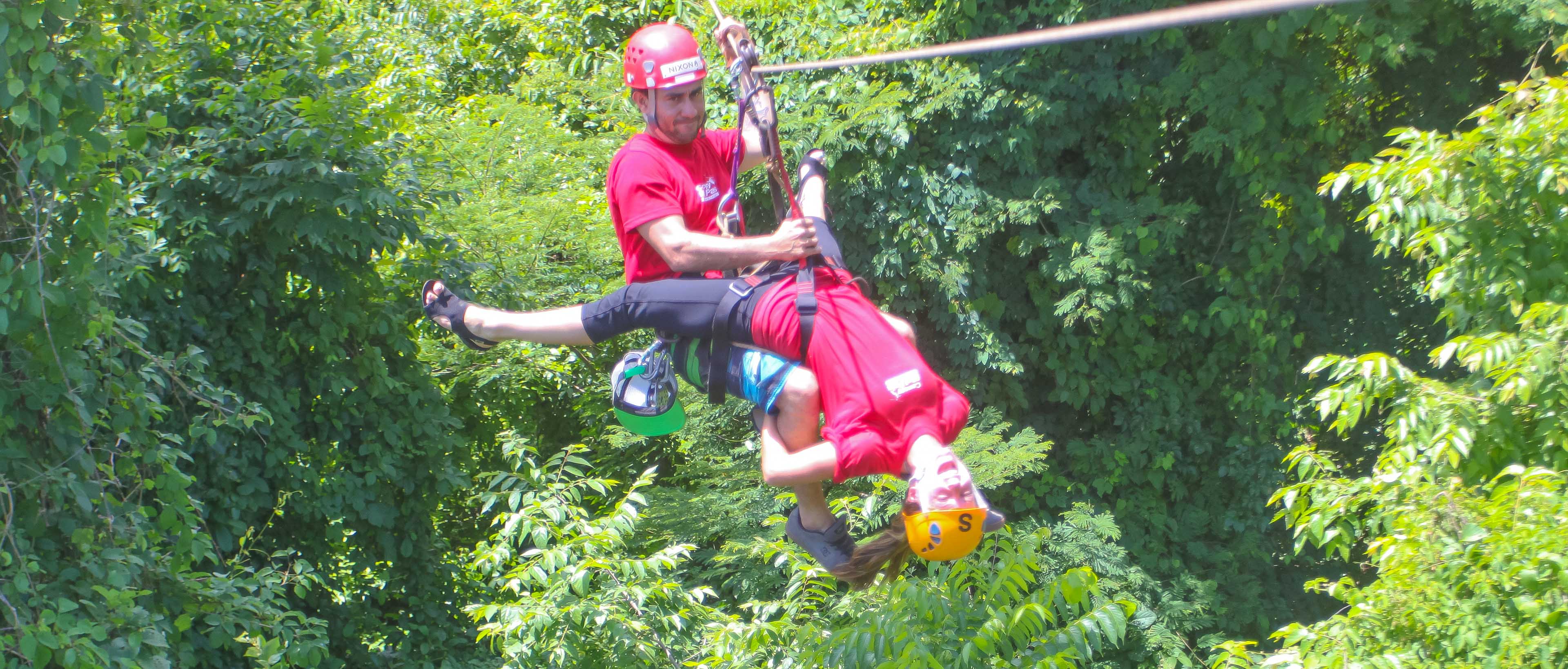 Staff Helping Lady Going Head Down Canopy Malpais