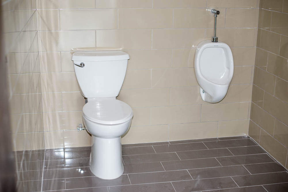 Urinals And Toleit On Disabled Accessible Bathroom On Each Floor