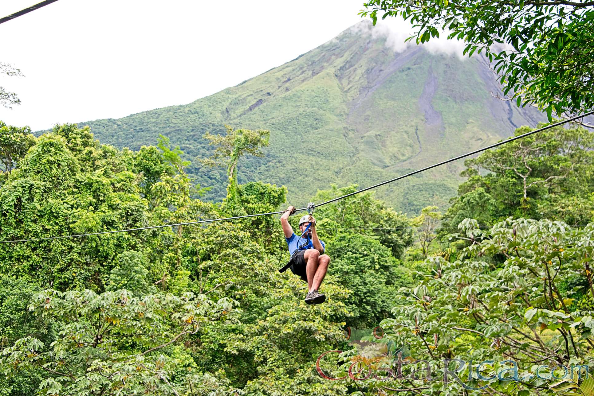 Zip Lining With Arenal Volcano Base In The Background Los Canones Canopy Tour La Fortuna