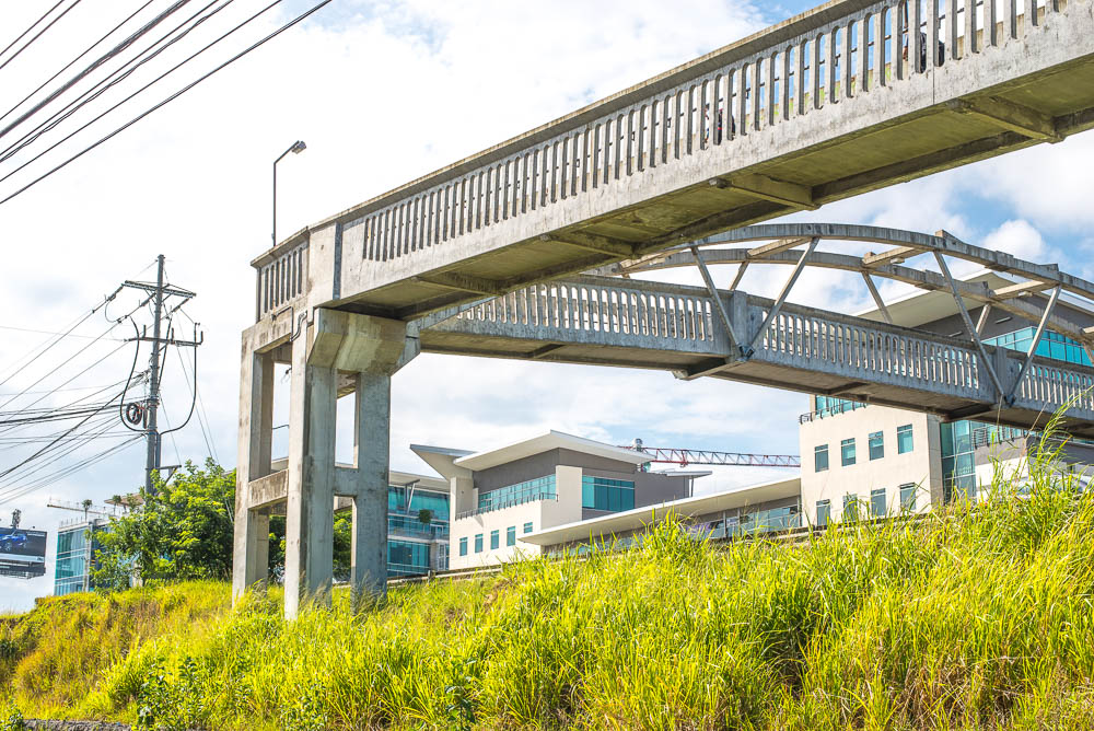 Pedestrian Bridge In Front Of The Lots In Escazu