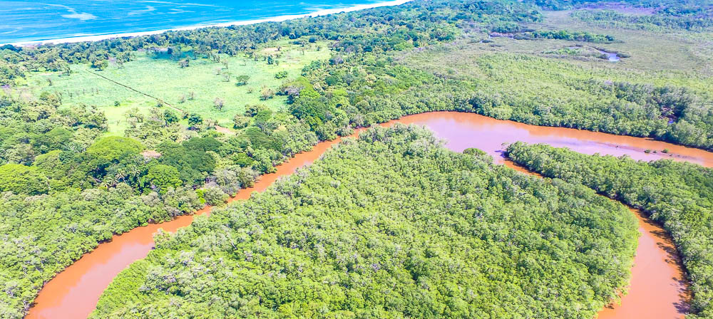 Aerial View Tamarindo Estauary Canal Loop And Playa Grande Front