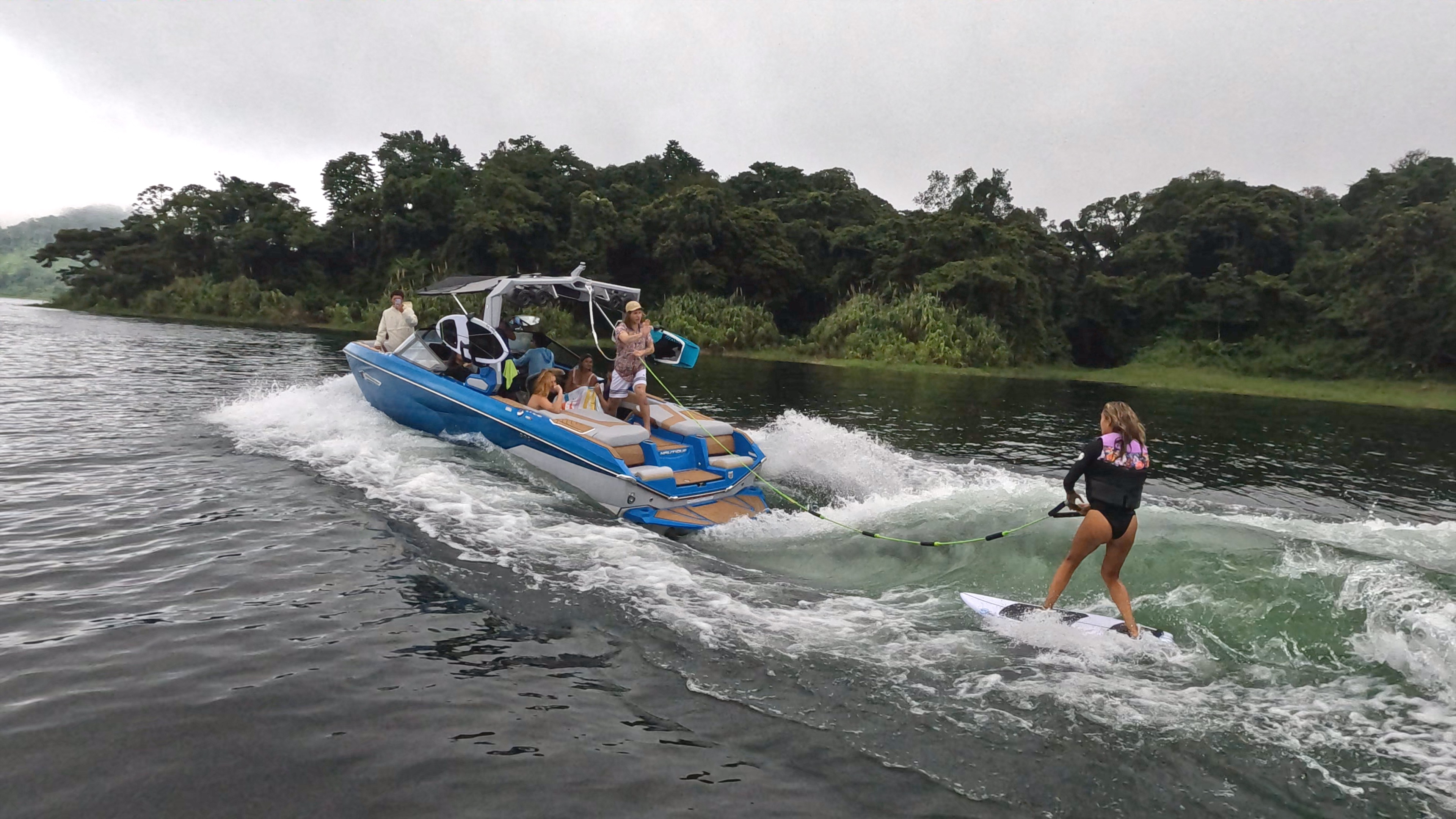 wakeboarding lesson on lake arenal an instructor tells a guest how to do it.jpg