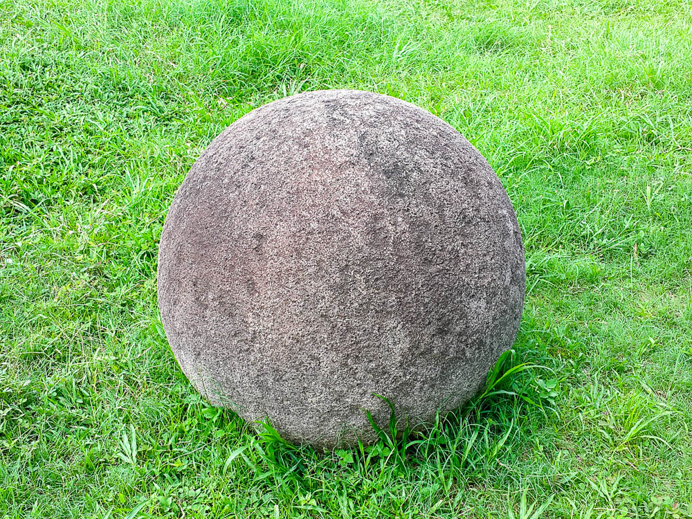 costa rica stone sphere on the grass at finca 6.jpg