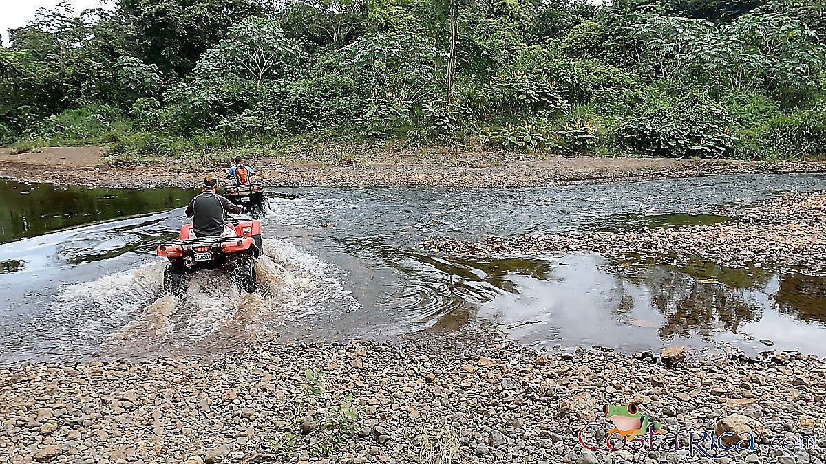 atv nosara tour crossing river confluence.jpg