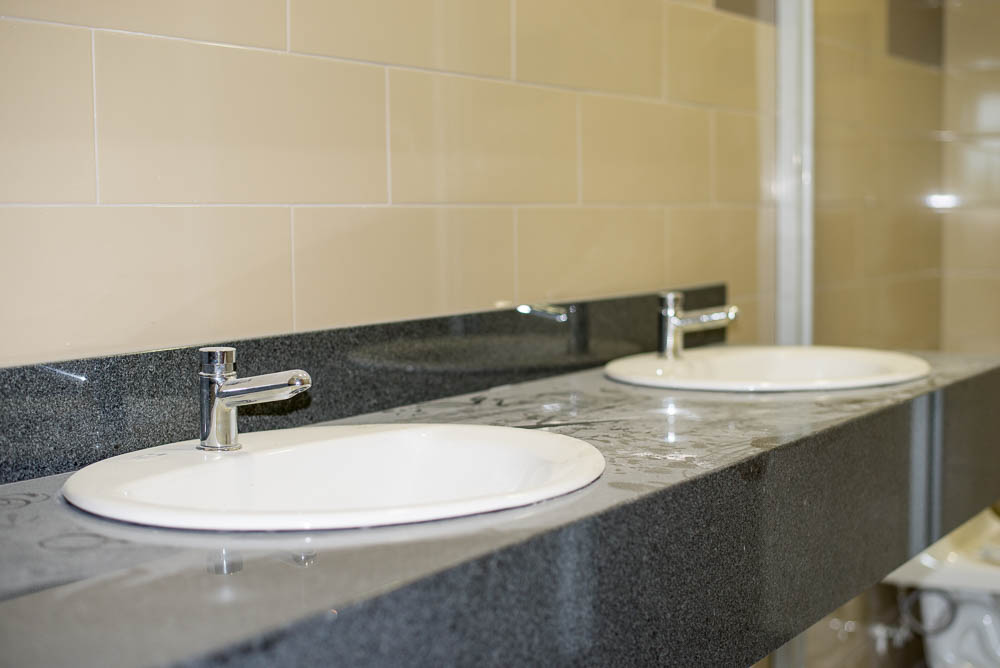 Buildling Has Twin Sinks On One Bathroom Per Floor