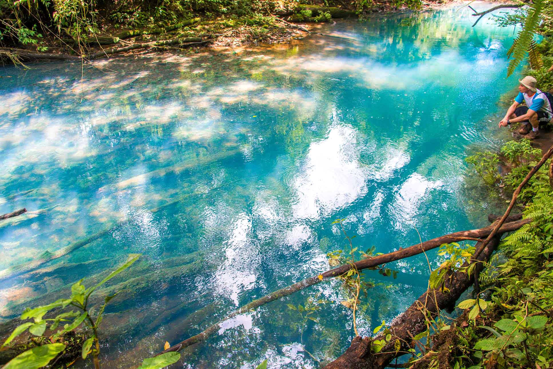 A Man Looking At The Blue River