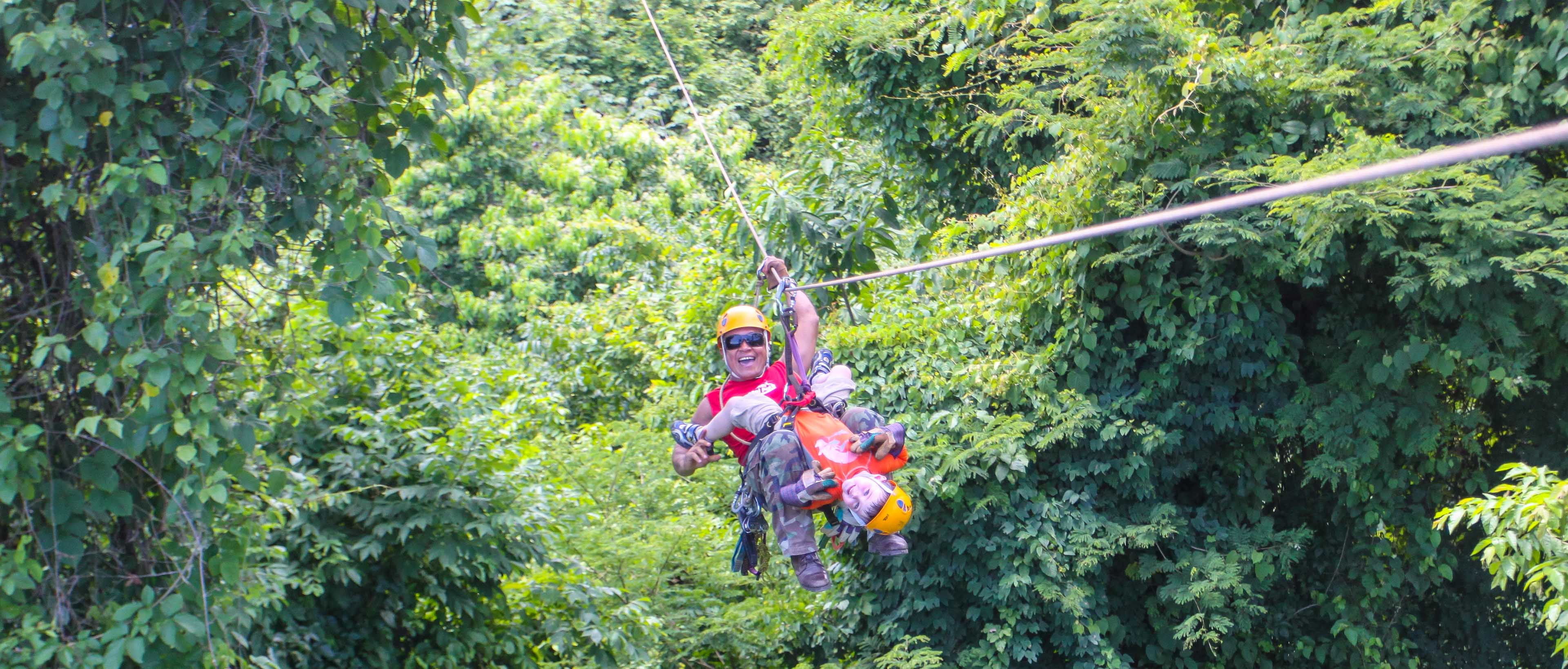 Staff With A Child Ziplining