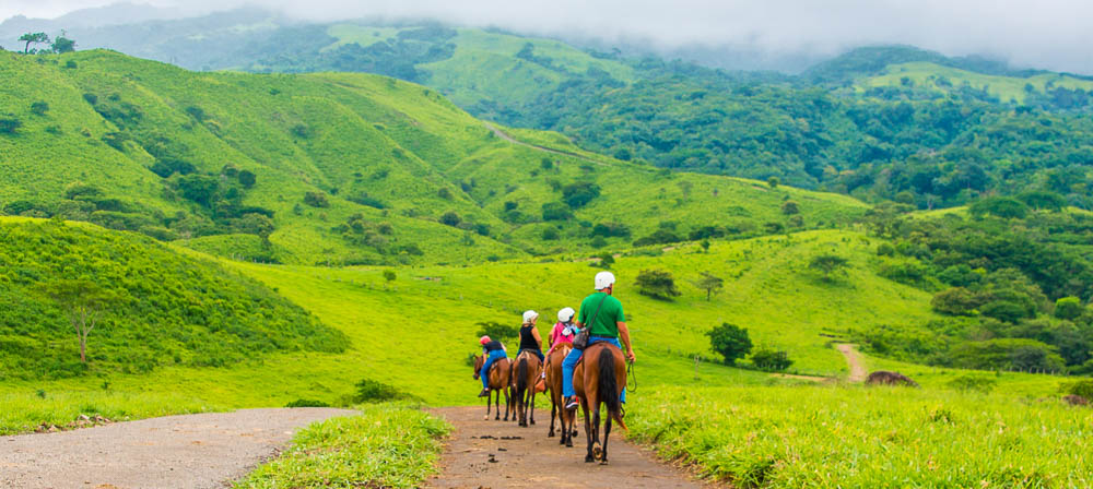 Group Descending To Tizati River Valley Horseback Ride Tour Western Side Of Rincon De La Vieja Volcano