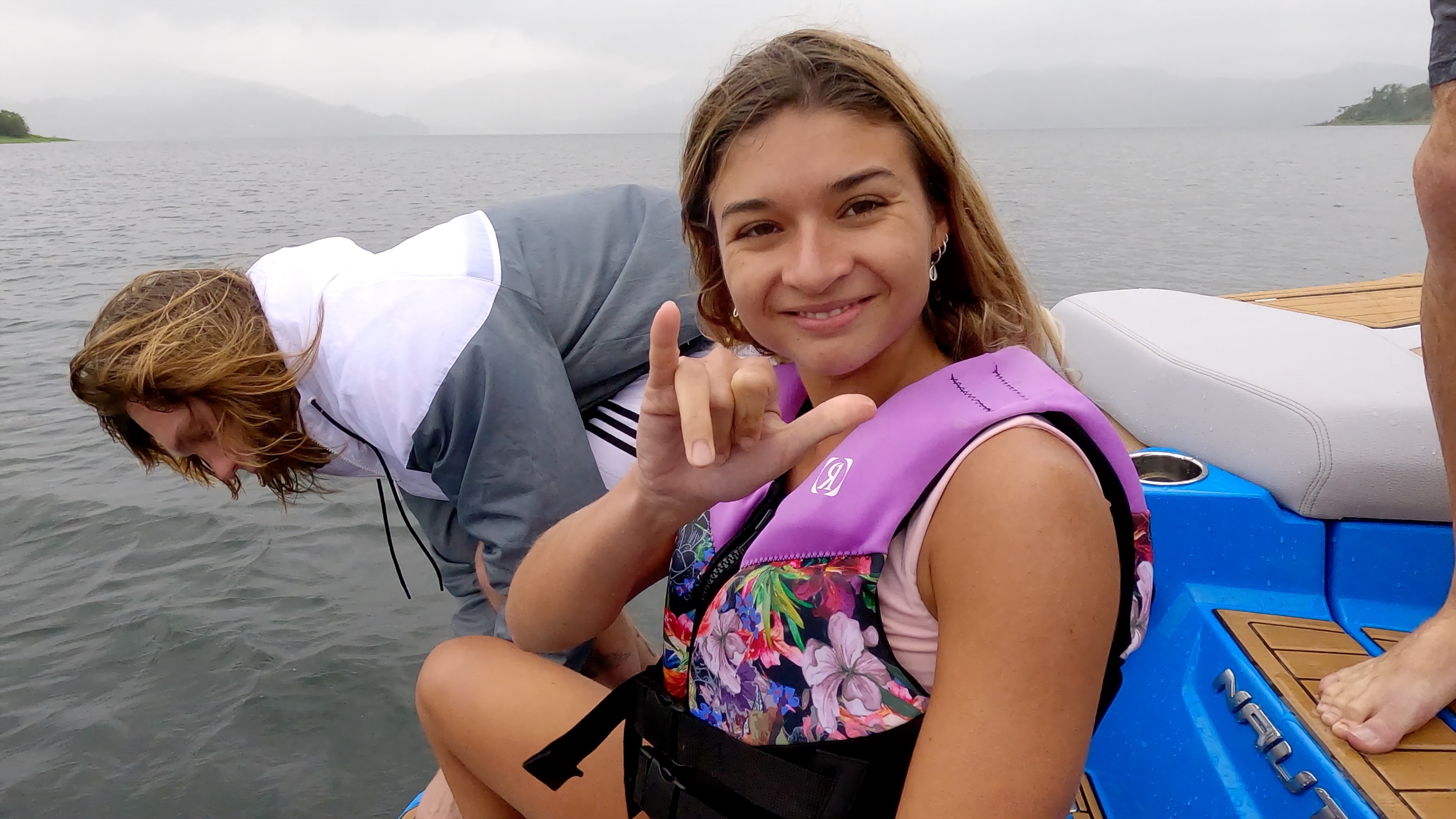 lady smiles to the camera as she prepares for jumping in the lake.jpg